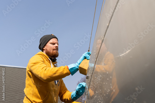 Man Cleaning His Yacht