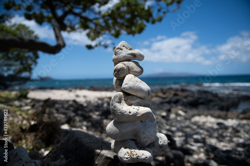 Tower of stones on sea beach background. Relaxing in the tropical beach, with stack of stones.