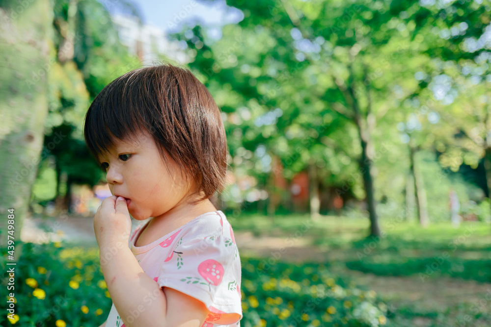 Little girl in the garden Little girl in the garden