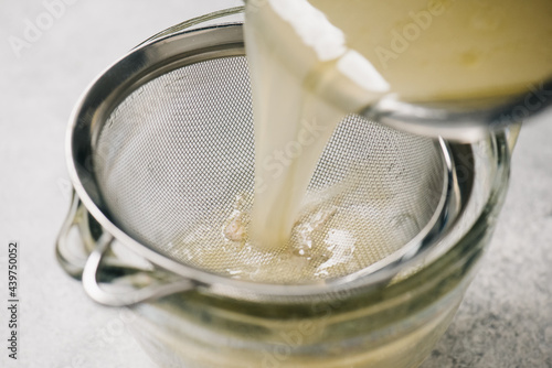 Straining chicken broth