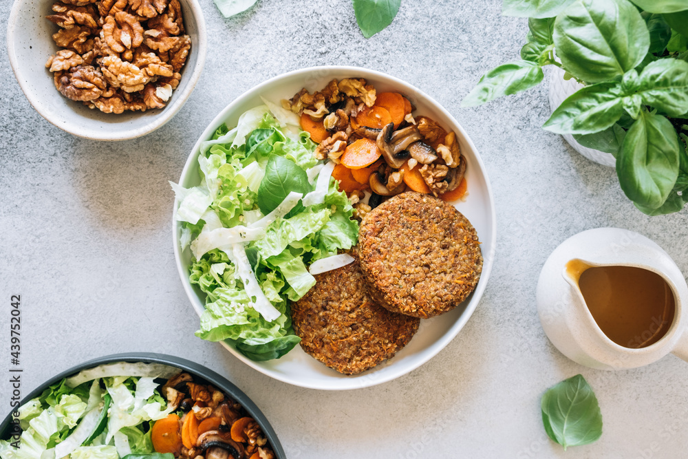 Top view of lentil patties with spicy carrots, mushrooms and fresh salad Top view of lentil patties with spicy carrots, mushrooms and fresh salad