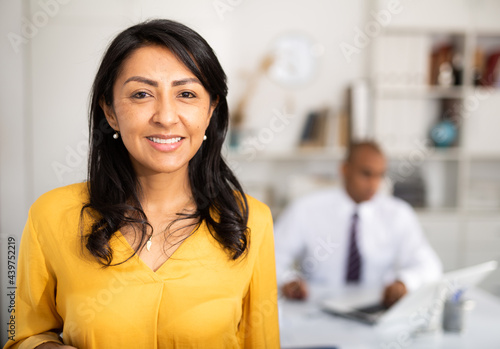 Portrait of a positive business woman in the office. High quality photo