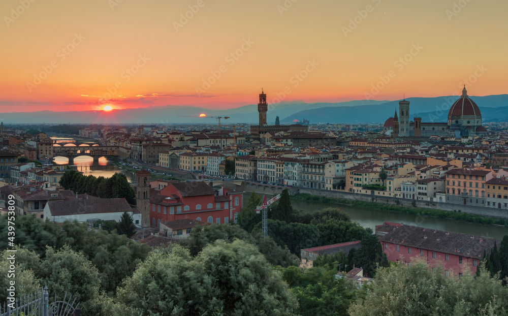 Florence, Italy -20 June, 2019 : panorama of the city at sunset, view from Piazzale Michelange to Cathedral of Santa Maria del Fiore, known for its red-tiled dome and Torre di Arnolfo - 95m-tall tower