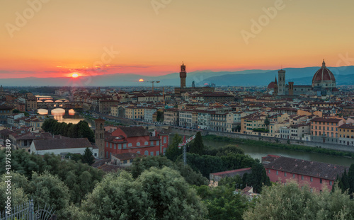 Florence, Italy -20 June, 2019 : panorama of the city at sunset, view from Piazzale Michelange to Cathedral of Santa Maria del Fiore, known for its red-tiled dome and Torre di Arnolfo - 95m-tall tower © Maria
