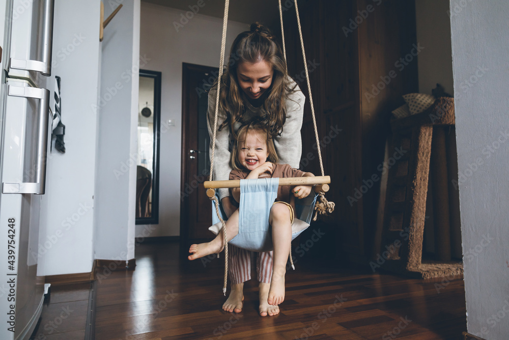 Child in hanging swing Child in hanging swing