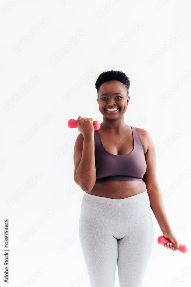 Young Woman Exercising in Studio Young Woman Exercising in Studio