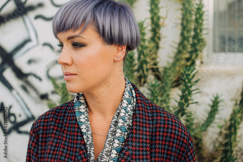 Portrait of a woman with make up and trendy lilac haircut  photo