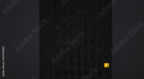 Dark office skyscraper in the evening photo