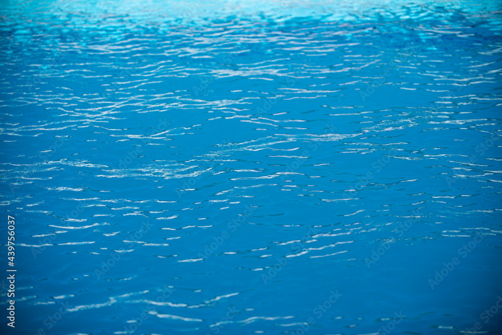 Ripple Water in swimming pool with sun reflection. Wavy water background. Ripple Water in swimming pool with sun reflection. Wavy water background.
