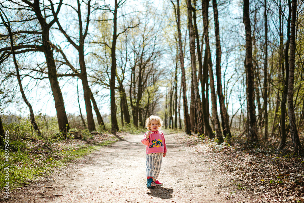 Little blond girl in the forest Little blond girl in the forest