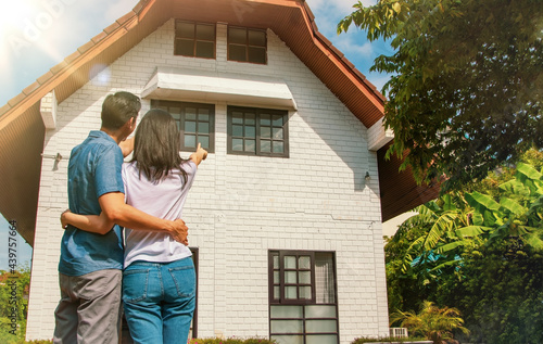 фотографія Living concept and family planning
 : Rear view Asian couple were proud to look