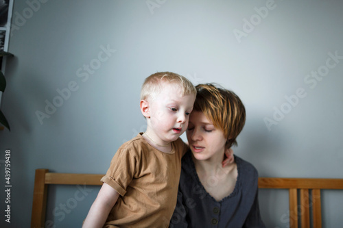 Young mother with her little son.