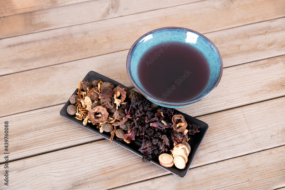 A bowl of sour plum soup and its ingredients A bowl of sour plum soup and its ingredients