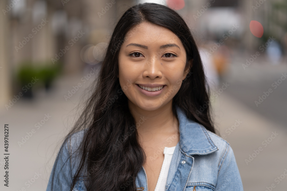 Young Asian woman in city smile happy face portrait Young Asian woman in city smile happy face portrait