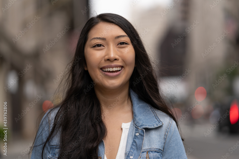 Young Asian woman in city walking street smile happy face Young Asian woman in city walking street smile happy face
