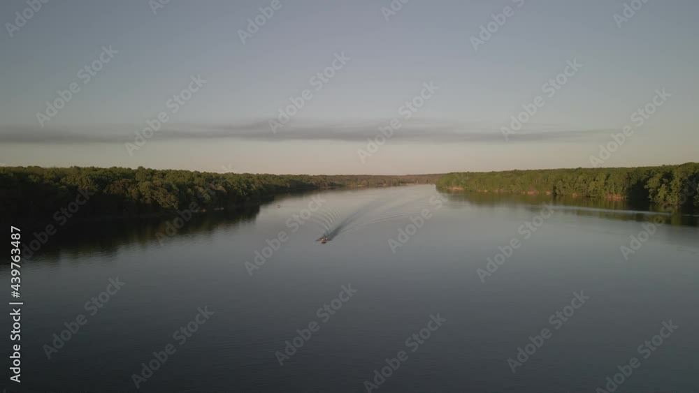 Aerial birds following view of a hige river bay under the setting sun. High quality 4k footage Aerial birds following view of a hige river bay under the setting sun. High quality 4k footage