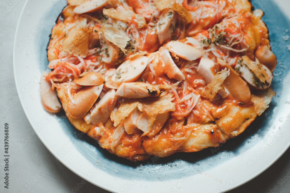 Tasty hot homemade pizza with hotdog and crab sticks with cheese. Tasty hot homemade pizza with hotdog and crab sticks with cheese.