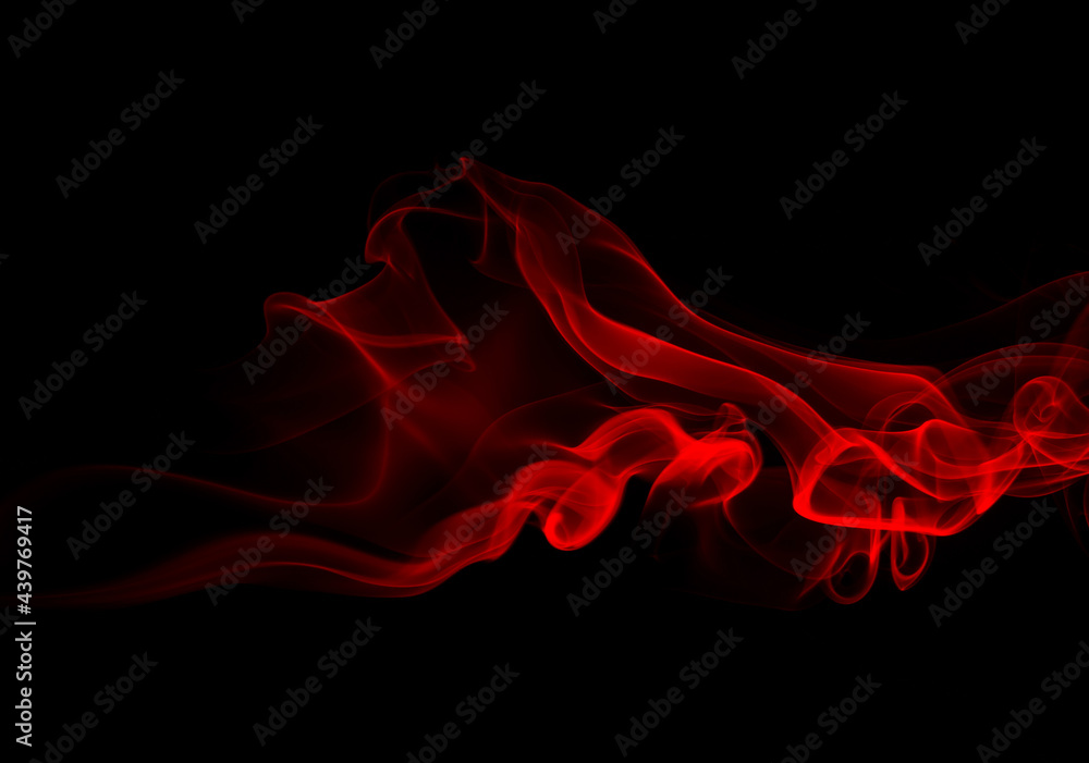 Red smoke on black background, fire design. copy space