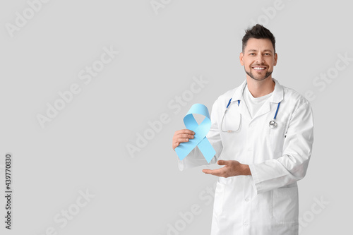 Oncologist with blue ribbon...