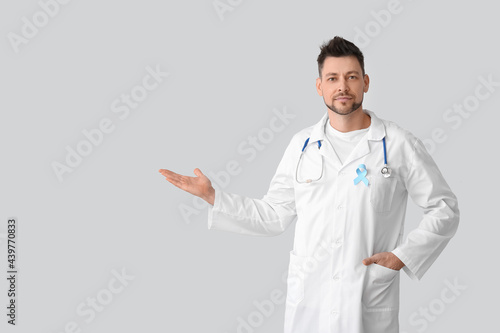 Oncologist with blue ribbon...