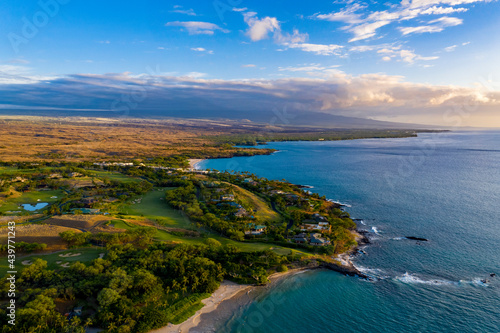 The Big Island's Kohala Coast with the dormant volcano of Hualalai in the distance