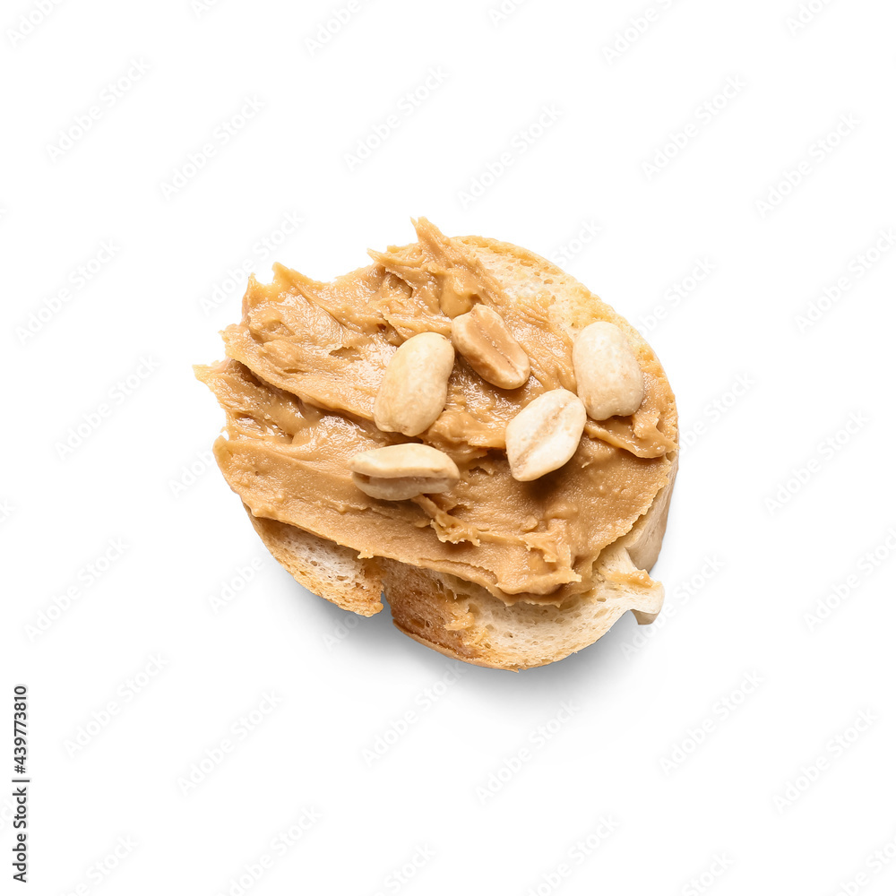 Piece of bread with tasty peanut butter on white background Piece of bread with tasty peanut butter on white background