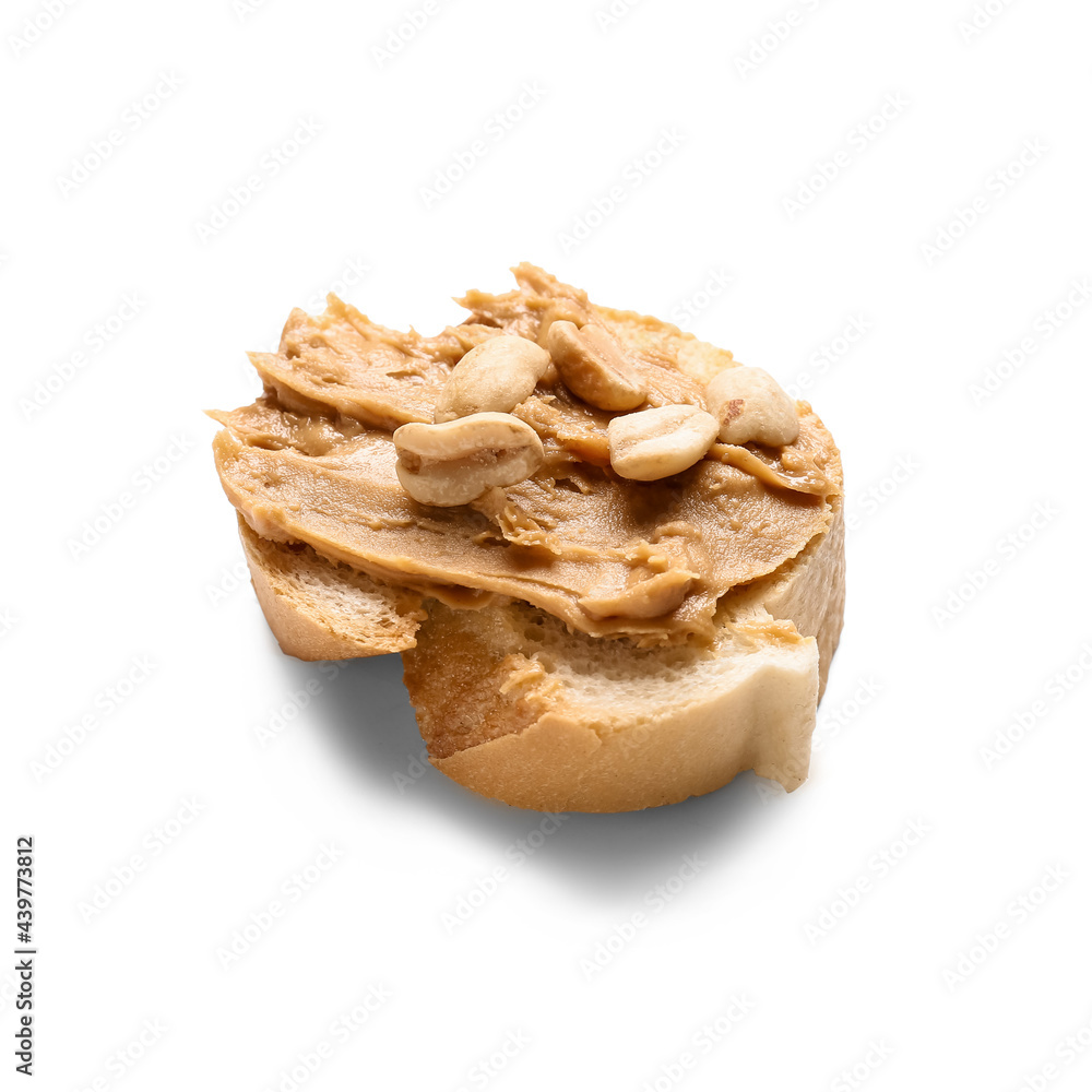 Piece of bread with tasty peanut butter on white background Piece of bread with tasty peanut butter on white background