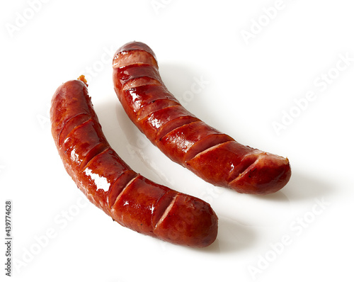 Grilled sausages isolated on a white background photo