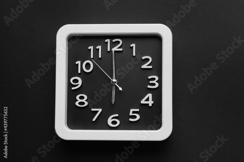 Stylish clock on dark background