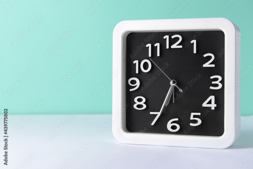 Stylish clock on color background Stylish clock on color background