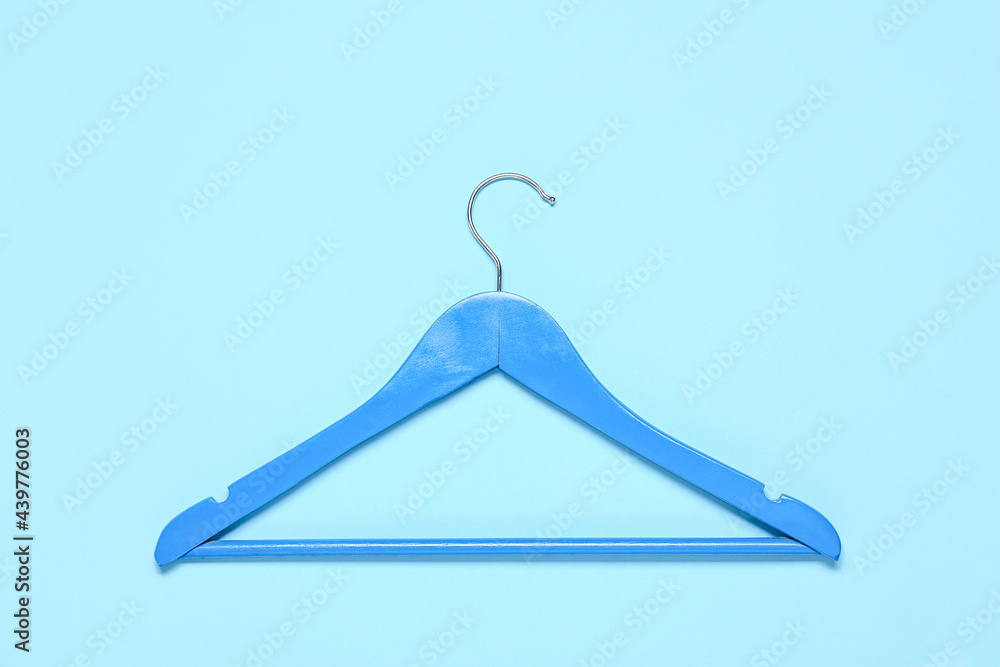 Stylish clothes hanger on color background Stylish clothes hanger on color background