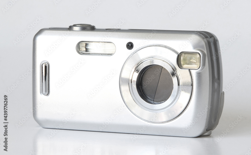 Old digital camera isolated, obsolete and not in use anymore Old digital camera isolated, obsolete and not in use anymore