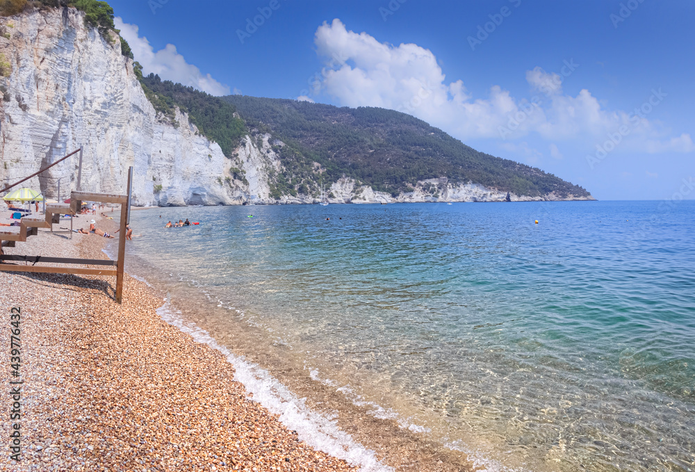 The most beautiful beaches of Apulia: Vignanotica. It is a stretch of pebbles and gravel, surrounded by the cliff dropping sheer to the sea, located in Gargano National Park near Vieste (Italy).