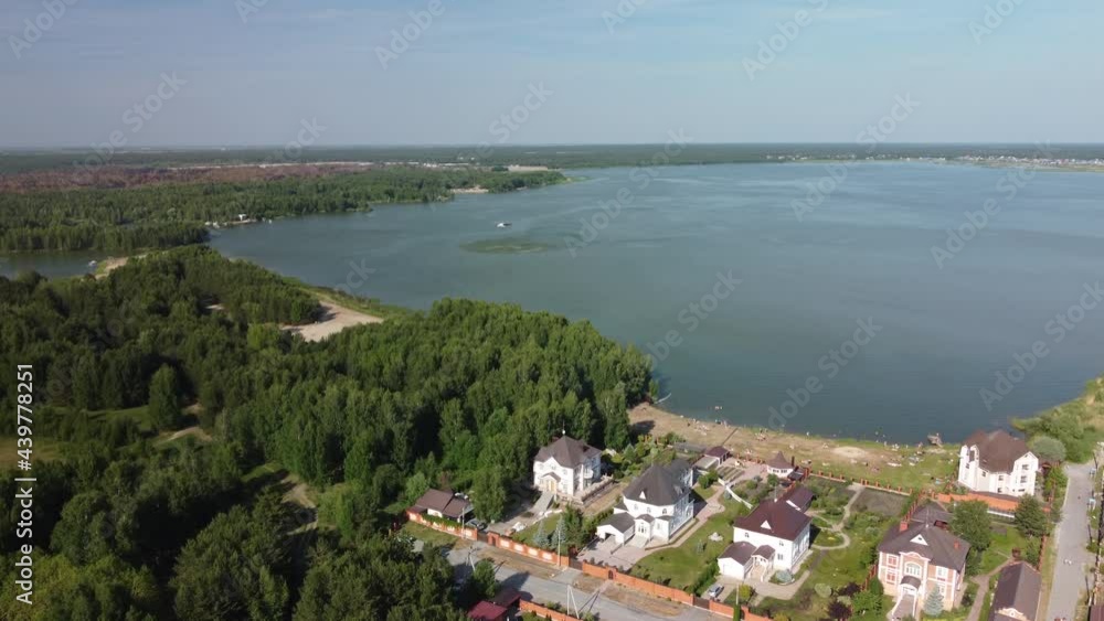 Tyumen, Russia - June 13, 2021: MI-8 helicopter of Emergency situations Ministry flies with water tank for fire extinguishing Tyumen, Russia - June 13, 2021: MI-8 helicopter of Emergency situations Ministry flies with water tank for fire extinguishing
