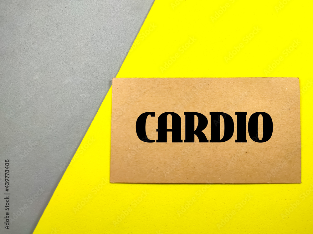 Obraz premium Education concept.Text CARDIO on brown card with gray and yellow background.