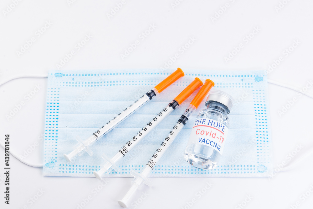 Concept of vaccination and medicine infectious: Syringe with injection vaccine and medicine disposable vaccination equipment. Cure for flu virus, Covid-19, pandemic infectious.concept of humanity's Concept of vaccination and medicine infectious: Syringe with injection vaccine and medicine disposable vaccination equipment. Cure for flu virus, Covid-19, pandemic infectious.concept of humanity's
