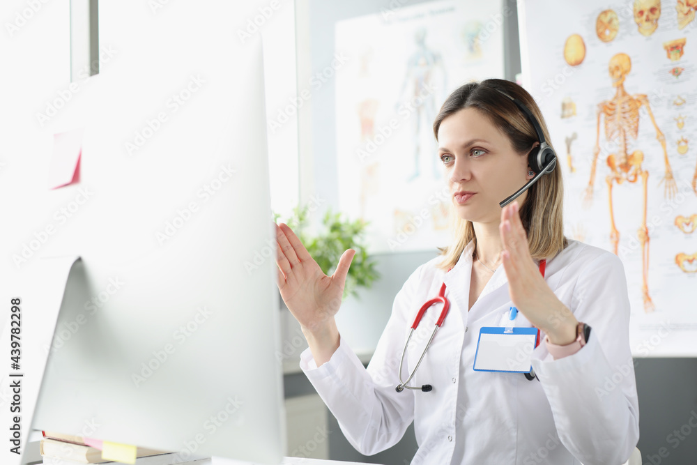 Female doctor conducts remote medical online consultation Female doctor conducts remote medical online consultation