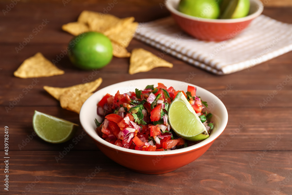 Bowl of tasty Pico de Gallo salsa on table Bowl of tasty Pico de Gallo salsa on table