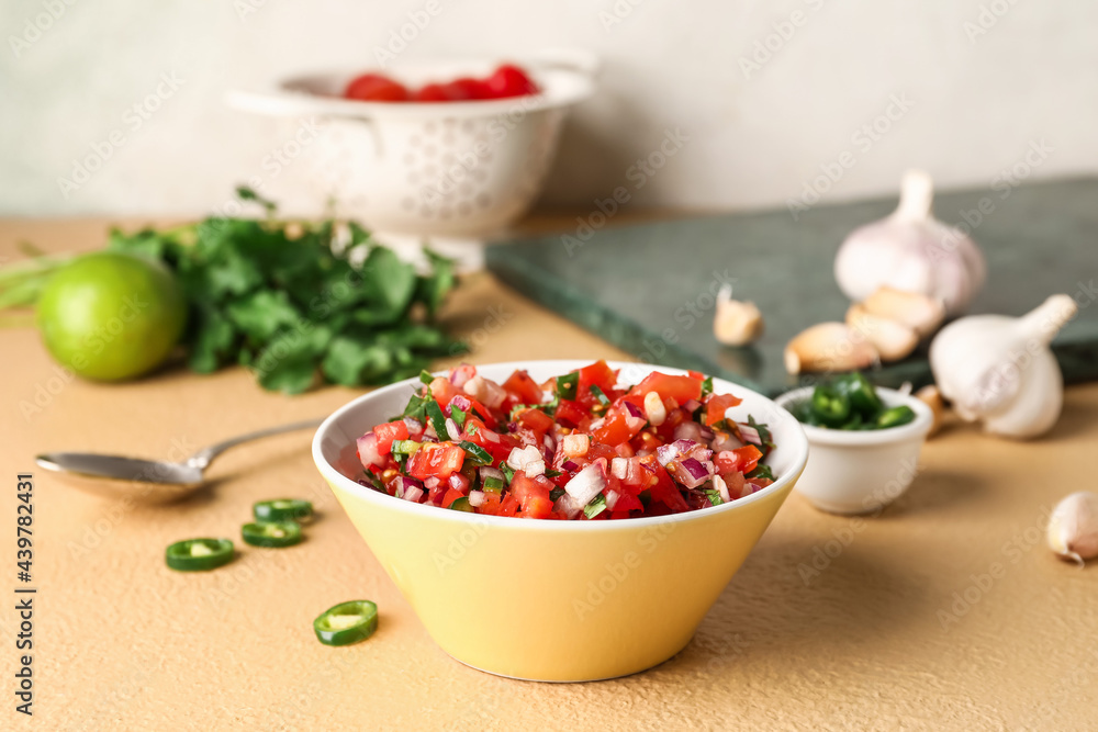 Bowl of tasty Pico de Gallo salsa on table Bowl of tasty Pico de Gallo salsa on table