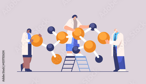 mix race research scientist working with molecular structure researchers making chemical experiment in laboratory