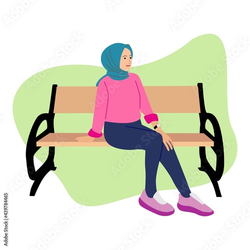 Girl wear hijab sitting on chair