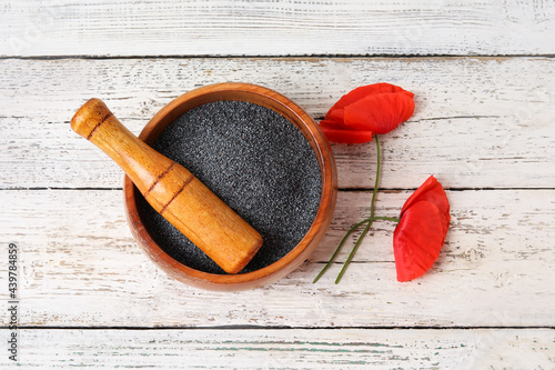 Poppy seeds in wooden bowl ...