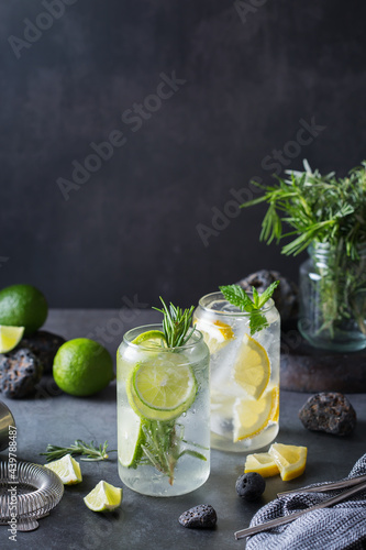 Hard seltzer cocktails with lime and lemon and bartenders accessories