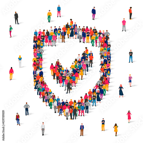 A large group of people in multicolored clothes stands in the form of a billboard with a check mark.