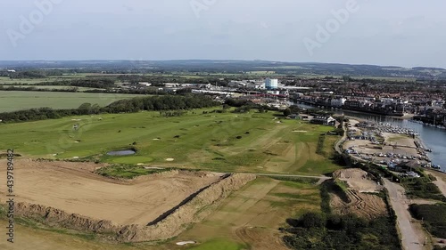 Aerial footage over Littlehampton Golf Course the only links course in West Sussex, with the River Arun and the town of Littlehampton in the background. photo