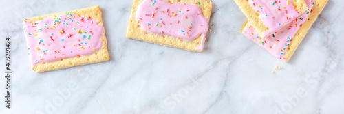 Pop tart, or toaster pastry panorama, top shot on a marble background with a place for text