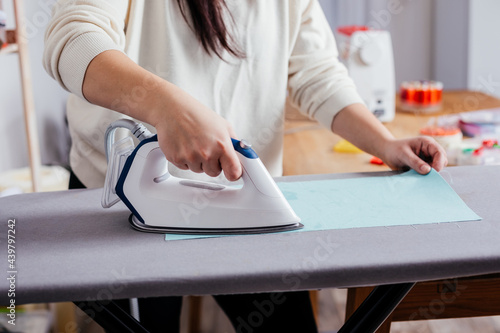 Process of ironing textile before cutting the pattern and sewing