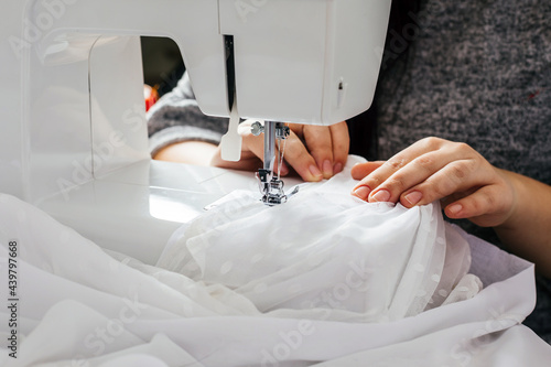 Принти на полотні Wedding dressmaker altering white vintage wedding dress