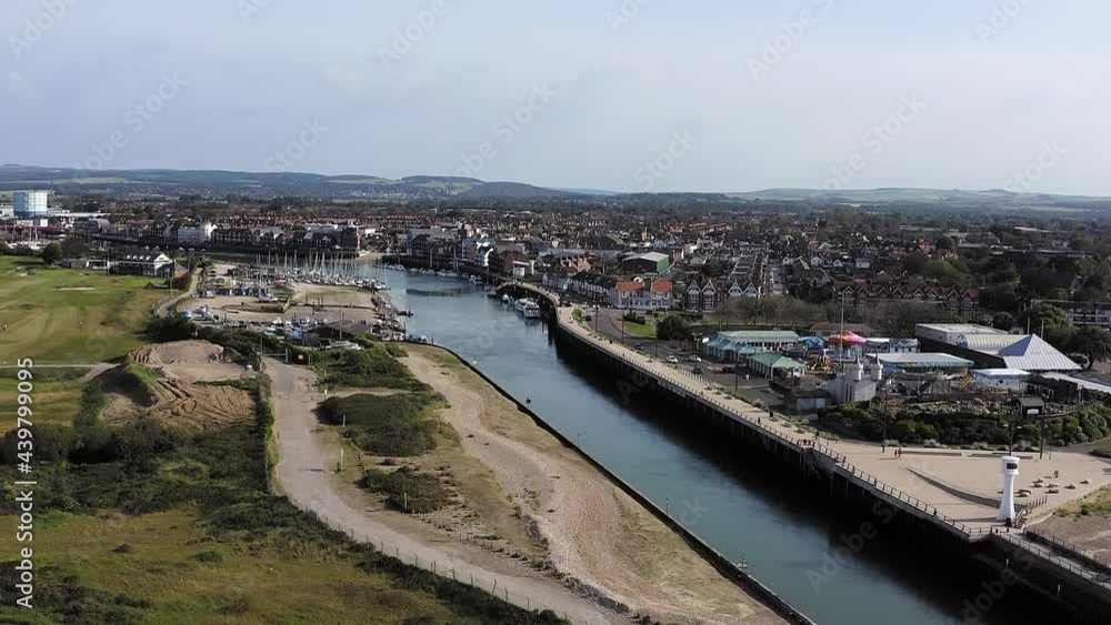 The River Arun running between the links golf course and the resort town of Littlehampton. Aerial footage