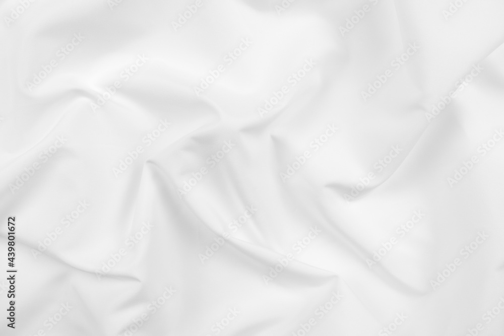 Abstract white fabric texture background. Cloth soft wave. Creases of satin, silk, and cotton.